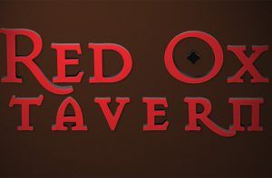 The Red Ox tavern logo is displayed on a brown background.