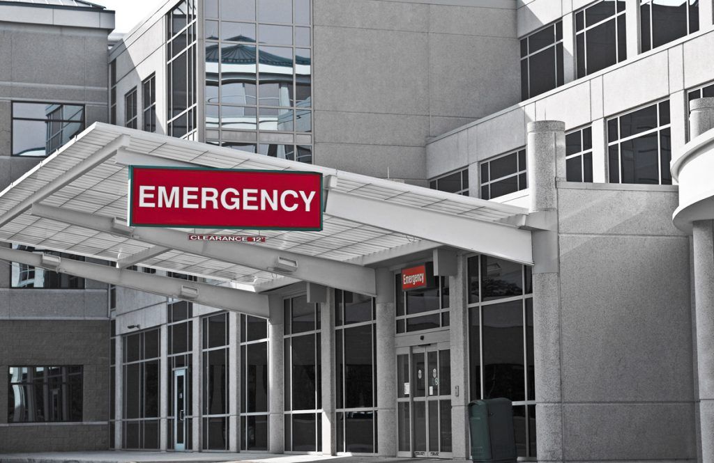 A hospital emergency room with the word " emergency " written on it.