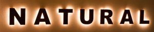 The lobby logo sign features the word 'natural' lit up on a wall.
