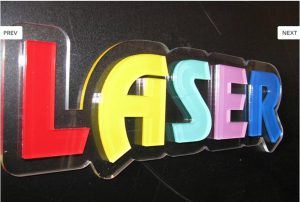 A colorful lobby sign with the word laser on it.
