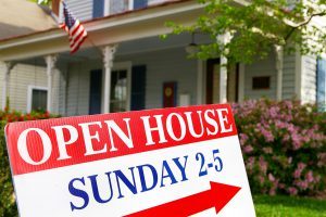 A red white and blue sign that says open house sunday 2-5