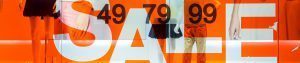wall-graphics-hero_1920x400_acf_cropped | Salient Sign Studio A sale sign in a store window.