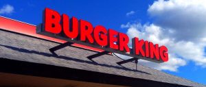 A burger king sign on the side of a building.